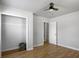 Bedroom showcasing wood floors, ceiling fan, closet and white trim at 4701 Ivydale Dr, North Charleston, SC 29405