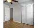 Bedroom featuring wood flooring, neutral walls, and closet at 4701 Ivydale Dr, North Charleston, SC 29405