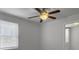 Bright bedroom featuring a ceiling fan, window with blinds, and neutral walls at 4701 Ivydale Dr, North Charleston, SC 29405