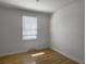 Cozy bedroom featuring wood flooring, natural light, and neutral walls at 4701 Ivydale Dr, North Charleston, SC 29405