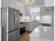 Modern kitchen features stainless steel appliances, white cabinets, and bright countertops at 4701 Ivydale Dr, North Charleston, SC 29405