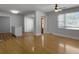 Open living space featuring wood floors, bar seating and natural light at 4701 Ivydale Dr, North Charleston, SC 29405