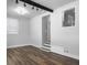 Bright room features hardwood floors, a large window, and a modern light fixture at 4701 Ivydale Dr, North Charleston, SC 29405