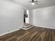 Bright living room featuring hardwood floors and an open doorway to the kitchen at 4701 Ivydale Dr, North Charleston, SC 29405