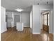 Open living space with wood floors, view to kitchen, and natural light at 4701 Ivydale Dr, North Charleston, SC 29405