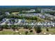 Aerial view of a charming neighborhood surrounded by trees and golf course, showcasing its appeal and picturesque setting at 505 Kilarney Rd, Summerville, SC 29483