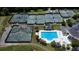 Aerial view of community pool and tennis courts surrounded by lush landscaping and well-maintained amenities, showcasing leisure options at 505 Kilarney Rd, Summerville, SC 29483