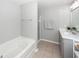 This bathroom features a soaking tub, walk-in shower, and a modern vanity with ample counter space at 505 Kilarney Rd, Summerville, SC 29483