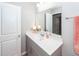 Cozy bathroom featuring a gray vanity, ample lighting, and a large mirror at 505 Kilarney Rd, Summerville, SC 29483