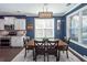 Traditional dining room featuring wood table, gray walls, white trim, and modern light fixture at 505 Kilarney Rd, Summerville, SC 29483