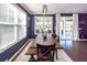 Inviting dining room with wood table and chairs, ample natural light, and backyard access at 505 Kilarney Rd, Summerville, SC 29483