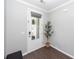 A welcoming entryway features a glass paneled door and natural light, complemented by stylish decor at 505 Kilarney Rd, Summerville, SC 29483