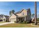 Inviting two-story home with a manicured lawn, attached garage, and a charming front porch, perfect for relaxing at 505 Kilarney Rd, Summerville, SC 29483