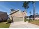 Charming two-story home with a two-car garage, well-manicured lawn and welcoming curb appeal at 505 Kilarney Rd, Summerville, SC 29483