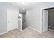 Upstairs hallway with neutral walls, carpet and white doors creating a bright and inviting space at 505 Kilarney Rd, Summerville, SC 29483