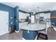 Modern kitchen featuring a granite island with seating, stainless steel appliances, and stylish pendant lights at 505 Kilarney Rd, Summerville, SC 29483