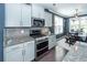Well-equipped kitchen featuring granite countertops, stainless steel appliances, and wood floors at 505 Kilarney Rd, Summerville, SC 29483