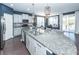 Modern kitchen features granite countertops, stainless steel appliances, white cabinets, and a breakfast bar at 505 Kilarney Rd, Summerville, SC 29483