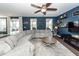 Living room with a gray sectional sofa and a view of the outdoor scenery through sliding glass doors at 505 Kilarney Rd, Summerville, SC 29483