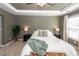 A stylish main bedroom featuring a ceiling fan, neutral walls, and a comfortable queen-size bed at 505 Kilarney Rd, Summerville, SC 29483