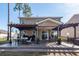 Spacious covered patio with outdoor dining, grill, and a view of the fenced backyard at 505 Kilarney Rd, Summerville, SC 29483