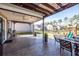 Covered patio featuring seating, ceiling fan, backyard views, and access to playset area at 505 Kilarney Rd, Summerville, SC 29483
