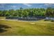 Enjoy outdoor recreation with well-maintained tennis courts surrounded by a scenic, wooded landscape at 505 Kilarney Rd, Summerville, SC 29483