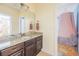 Bright bathroom features a granite countertop, dark wood cabinets and a bedroom with a canopy bed at 545 Two Mile Run, Johns Island, SC 29455