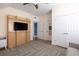 Bright bedroom features a fold-down television set and wood floors beneath a colorful rug at 545 Two Mile Run, Johns Island, SC 29455