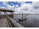 Waterfront view of a wooden dock with a covered seating area and access to boating activities at 545 Two Mile Run, Johns Island, SC 29455