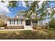 Charming two-story home boasting manicured landscaping, shutters, and a welcoming front porch at 545 Two Mile Run, Johns Island, SC 29455