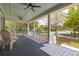 Inviting front porch with blue-painted ceiling, comfortable seating and neighborhood views at 545 Two Mile Run, Johns Island, SC 29455