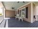 Inviting front porch with comfortable seating, ceiling fans, and classic architectural details at 545 Two Mile Run, Johns Island, SC 29455