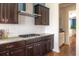 Kitchen featuring gas range cooktop, granite countertops, and dark wood cabinets at 545 Two Mile Run, Johns Island, SC 29455
