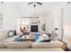 Spacious living room showcasing a fireplace, comfortable seating and hardwood floors at 545 Two Mile Run, Johns Island, SC 29455