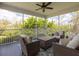 Inviting screened-in porch with wicker furniture and lush greenery views for outdoor relaxation at 545 Two Mile Run, Johns Island, SC 29455