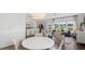 Bright living room with modern furniture, hardwood floors, and a view of the outdoors at 584 Red Monarch Way, Moncks Corner, SC 29461