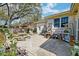Spacious backyard with concrete patio, outdoor seating, and mature trees and landscaping at 633 Schooner Rd, Charleston, SC 29412