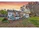 Landscaped backyard with brick patio, outdoor seating, and lush greenery, perfect for enjoying peaceful evenings at 633 Schooner Rd, Charleston, SC 29412