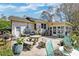 Picturesque backyard featuring a large patio, outdoor seating, and beautiful garden area at 633 Schooner Rd, Charleston, SC 29412
