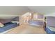 Attic bedroom with two twin beds and access to stairway at 633 Schooner Rd, Charleston, SC 29412