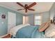 Comfortable bedroom with hardwood floors, a ceiling fan, and a patterned rug at 633 Schooner Rd, Charleston, SC 29412