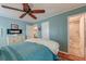 Relaxing bedroom with blue walls, hardwood floors, and ensuite bathroom access at 633 Schooner Rd, Charleston, SC 29412