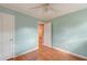 Bright bedroom features fresh paint, hardwood floors, ceiling fan, and en suite access at 633 Schooner Rd, Charleston, SC 29412