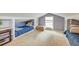 Attic bedroom with two twin beds and built in storage at 633 Schooner Rd, Charleston, SC 29412