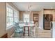 Cozy dining room with wood floors, chandelier lighting, and stainless steel refrigerator at 633 Schooner Rd, Charleston, SC 29412