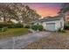Inviting home exterior with a well-maintained lawn, private driveway, and neatly trimmed hedges, perfect for a Gathering at 633 Schooner Rd, Charleston, SC 29412