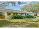 Charming single-story home with well-maintained landscaping and a lush green front yard at 633 Schooner Rd, Charleston, SC 29412