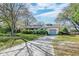 Charming home exterior with a well-manicured lawn, inviting driveway, and lush landscaping, creating a welcoming curb appeal at 633 Schooner Rd, Charleston, SC 29412
