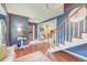 Elegant foyer featuring hardwood floors, a staircase, and stylish decor, offering a warm welcome into the home at 633 Schooner Rd, Charleston, SC 29412